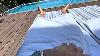 Busty chick in wet t-shirt looks for some action by a public pool