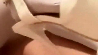 MILF in Pantyhose and Heels Gives a Footjob