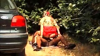 Horny milf enjoys wild ride on big black cock outdoors