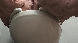She's Enjoying Rubbing Her Pussy on the Toilet