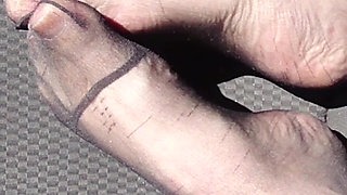 Feet of Nylonjunge in Pantyhose in Car
