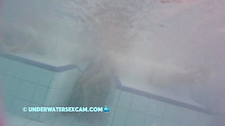This Young Couple Plays Together Underwater In Front Of Many People