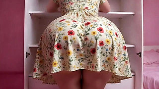big-bootied woman in a dress shaking it sexy