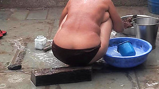 My elder sister-in-law's stepsister is bathing naked in red tights in the open bathroom at my house