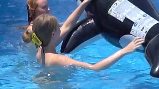 Lesbian Girls Are Having Fun in a Pool with an Inflatable Shark