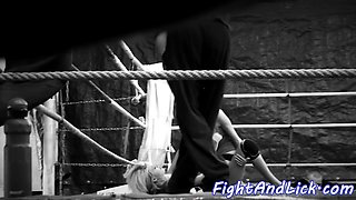 Lesbian beauties wrestling in a boxing ring