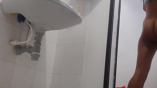 Flacaquita Latina masturbates in the bathroom and makes a video for her lover.