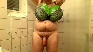 Taking a shower with big balloon tits