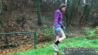 Watch these cute girls pee all over themselves in the woods
