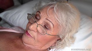 Granny Norma cheats on her sleeping husband with young stud