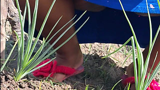 Hot stepmom went to the garden in a dress without panties and neighbor filmed